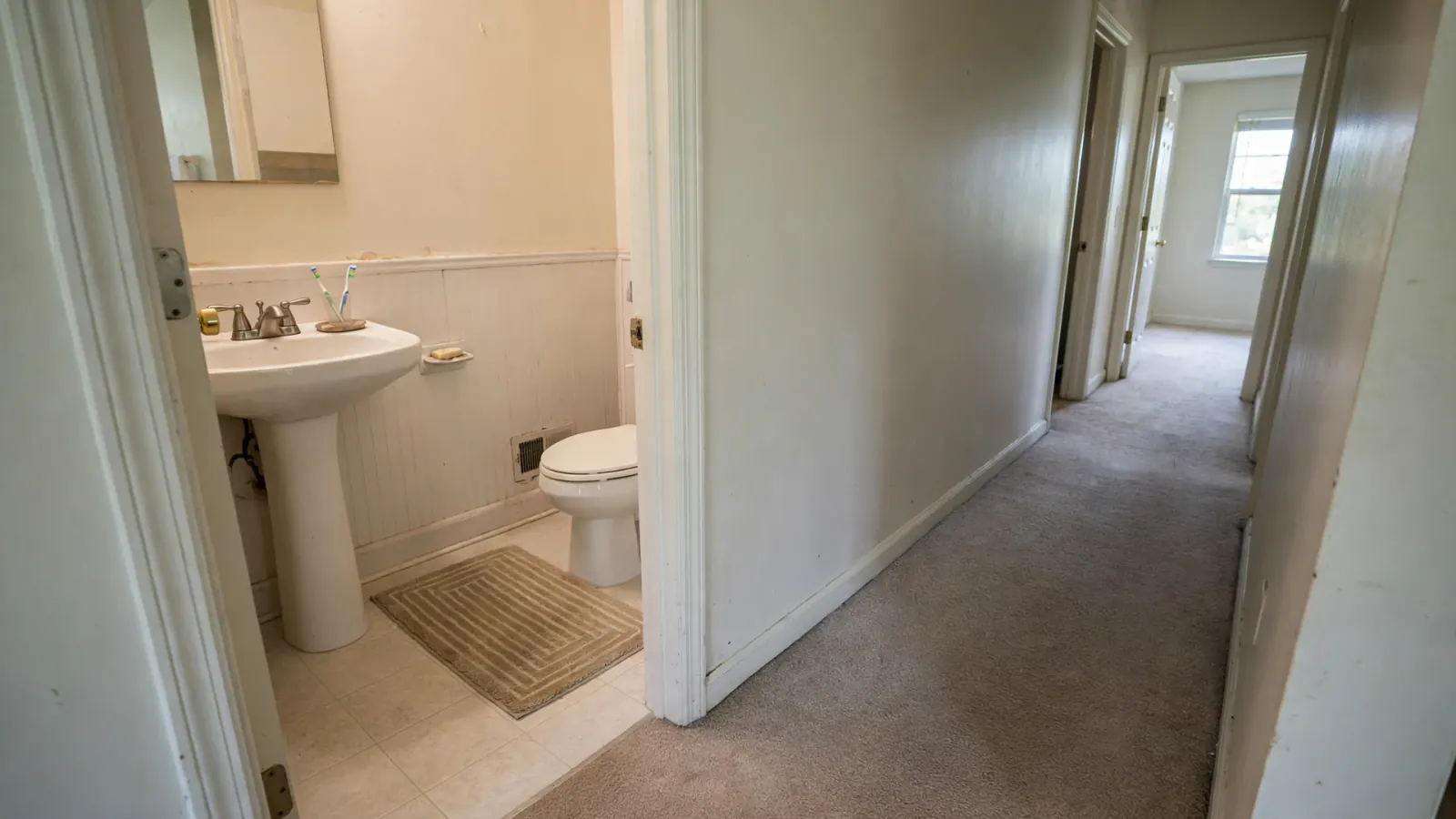 After: The same bathroom and hallway cleaned and restored