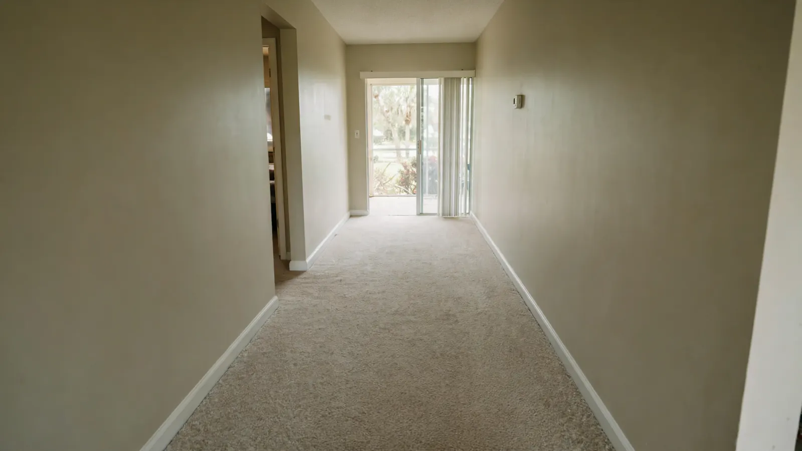 After: The same hallway with walls rebuilt and dry carpet